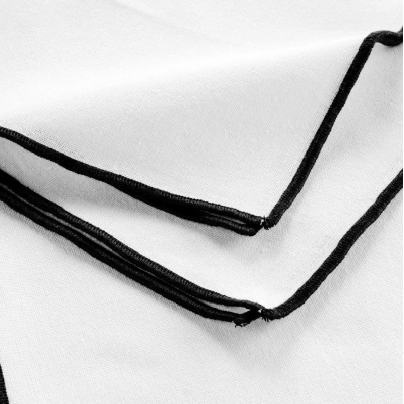 White napkin with black trim