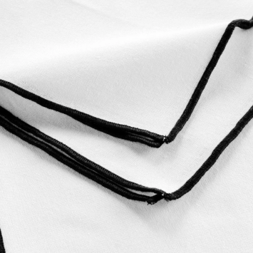 White napkin with black trim